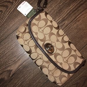 Large original coach wristlet, never used